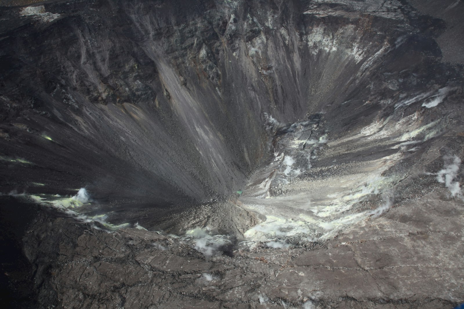 Aerial view of Halemaʻumaʻu lava lake inside Kīlauea caldera, Hawaii Volcanoes National Park — active eruption visible from above